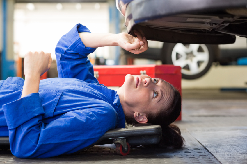 Girl Mechanic under car